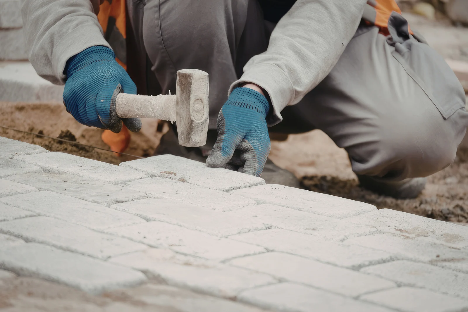 Worker Installing Pavers